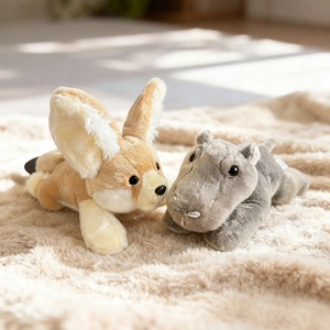 Cute plush crocodile and fox animal toys lying on a soft rug for kids comfort