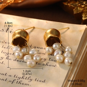 Detail of vintage gold pearl earrings showing dimensions and weight on retro paper