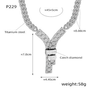 Detail of silver titanium steel necklace with cuban chain and diamond honeycomb pendant