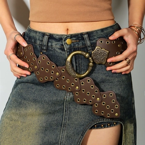 Bohemian brown studded leather belt featuring large round carved vintage buckle