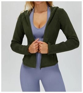 Close-up of slim-fit thermal hoodie with zipper and ribbed seamless yoga leggings set