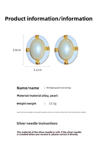 Detail view of vintage oval pearl earrings with blue oil drip and 2.6cm dimensions