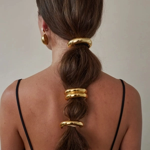 Minimalist gold stainless steel ponytail cuffs hair accessories shown on model