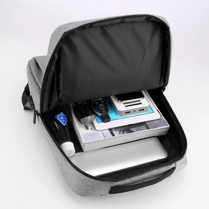 Grey business laptop backpack with USB port and organized multi-layer storage compartments