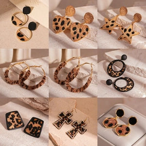 Leopard print flocked geometric earrings set with heart and star shapes in gold metal