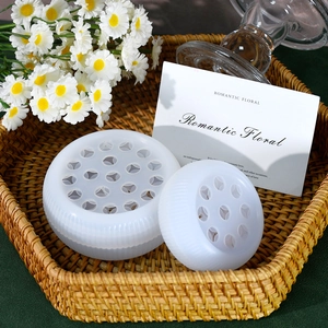 Macro detail of the white silicone flower stem holders with porous structure in a basket