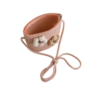 Pink woven straw crossbody bag for girls with decorative flowers and zipper closure