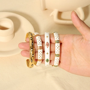 Vintage 18K gold stainless steel bracelet set with white enamel and blue evil eye detail