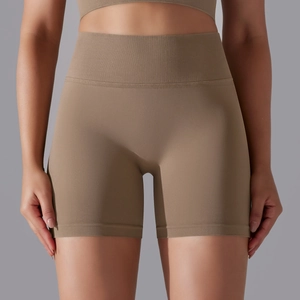 Detail of high-waisted seamless ribbed yoga shorts in deep khaki with elastic compression