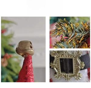 Detail shot of golden bell on velvet hat and belt buckle of 18-inch Santa Claus doll