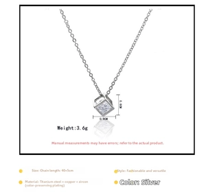 Macro detail of silver cube pendant necklace with measurements 0.8cm and 40+5cm chain