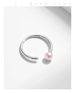 Detailed view of natural pink pearl on an adjustable S925 sterling silver minimalist ring