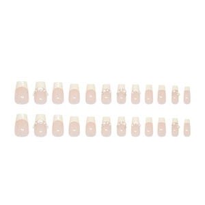 Short ballet press-on nails in creamy yellow and white french style with pearls and hearts