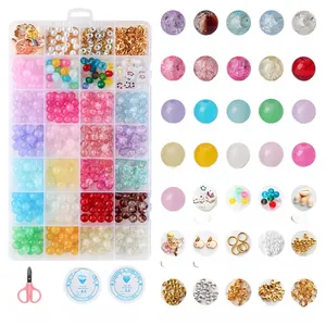 Detail of 24-grid DIY jewelry kit with crackle beads, pendants, tools and elastic cord