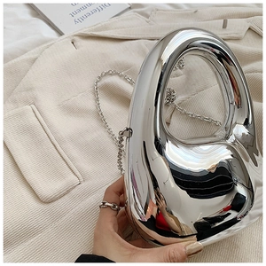 Sleek silver mirror acrylic clutch bag with abstract fluid design and chain strap