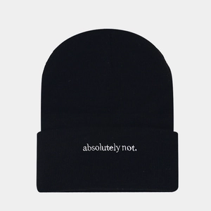 Close-up of 'absolutely not.' embroidery on a black ribbed knit beanie hat