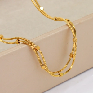 Double-layered 18K gold-plated titanium steel necklace with small cube bead accents