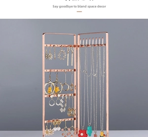 Detailed view of rose gold iron earring organizer with necklace hooks and folding design