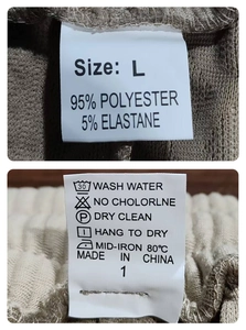 Detail view of clothing label showing L size and 95 percent polyester material composition