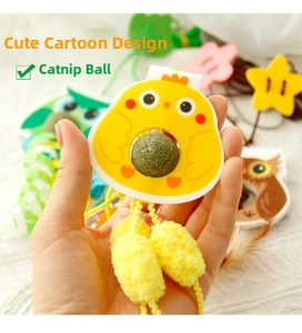 Detail showing hand holding yellow chicken felt cat toy with built-in catnip ball