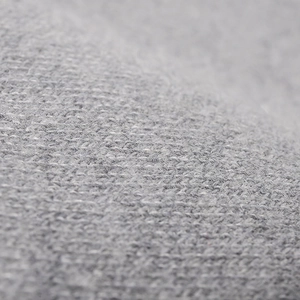 Close-up of warm grey knit beanie hat featuring soft wool texture and premium craftsmanship