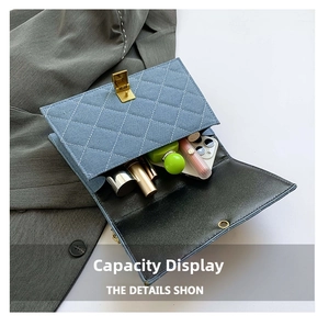 Capacity display of blue quilted denim shoulder bag showing phone and cosmetics