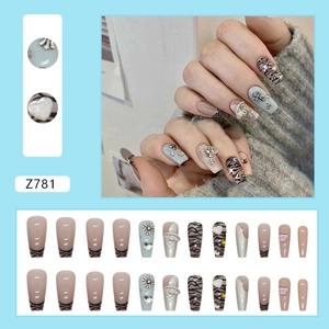 Silver leopard print French press-on nails with shiny rhinestones and cross charms