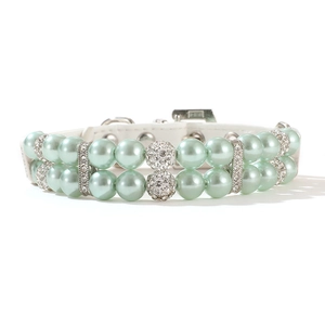 Close-up of double-row mint green pearl pet collar with rhinestone ball and metal buckle