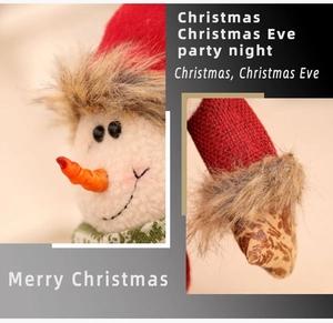 Detail of plush snowman features and fabric craftsmanship on Christmas gift bag