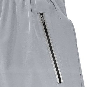 Close-up of waterproof zipper pocket and durable fabric texture on men's sports shorts