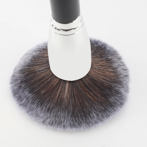 Macro close-up of soft gradient bristles on a professional large powder makeup brush
