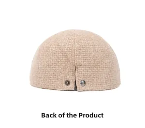 Detail view of the camel knitted beret back with two vintage dark metal buttons