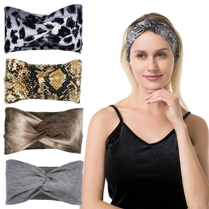 Detailed view of assorted yoga headbands featuring leopard, snake skin, and tie-dye patterns