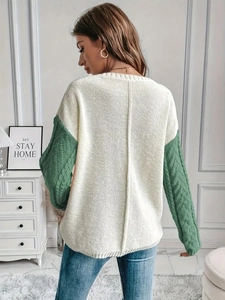 Chunky knit sweater for women featuring cream body and contrast green sleeves