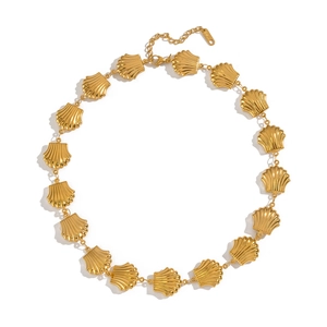 Detail of gold shell link necklace with lobster clasp and S.Steel hallmark on white backdrop