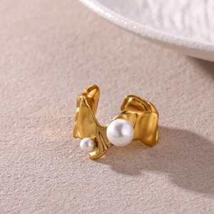 Irregular golden stainless steel ring with two pearls featuring molten metal texture