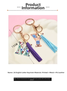 Detail of letters M and Y keychains with floral patterns and colorful PU tassels