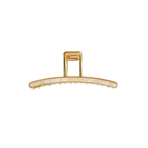 Elegant gold metal shark hair claw clip with mother of pearl inlay on white background