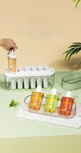 Detail view of DIY ice pop molds with clear base and multi-colored homemade popsicles