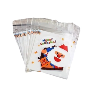 Clear plastic Christmas candy bags with Santa Claus and Reindeer for holiday gift packaging