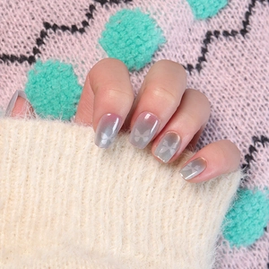 Silver cat eye press-on nails with butterfly designs on mid-length square round tips