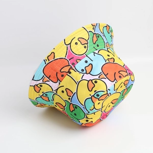Double-sided reversible bucket hat featuring colorful cartoon duck pattern for sun protection