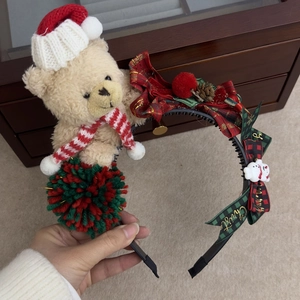 Detailed Christmas headband with teddy bear, red green pom-poms, and Merry Christmas bow