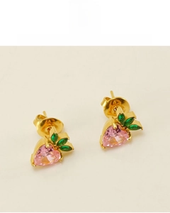 Macro detail of strawberry stud earring with pink heart zircon and green leaf gems