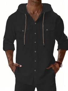 Detail of black linen hooded shirt with drawstring neckline and double chest pockets