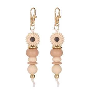 Detail of beaded daisy charms featuring sunflower silicone beads and golden metal clasp