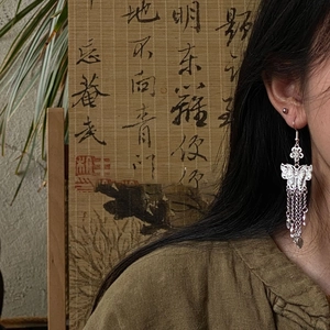 Silver butterfly and flower tassel earrings with hollow design for a minimalist style