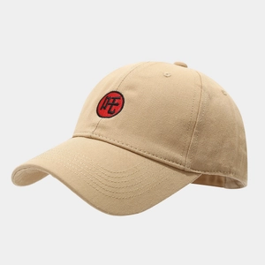 Detail of khaki cotton baseball cap with red Zha embroidery and twill fabric texture