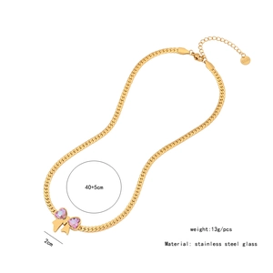 Detail of bow necklace with pink hearts and size specs: 40+5cm length, 2cm pendant
