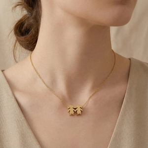Elegant gold stainless steel necklace featuring a sisters pendant on a dainty link chain